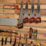 a collection of saws and other tools in a woodworking shop
