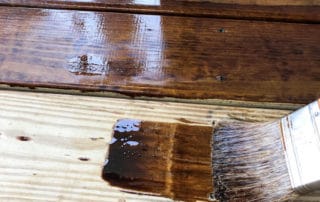 pressure-treated wood deck with stain on it
